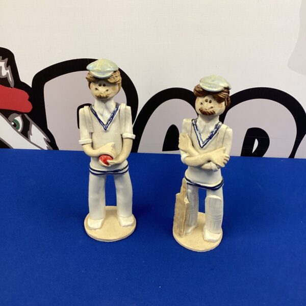 Vintage Laura Dunn ceramic cricket figurine in classic pose.