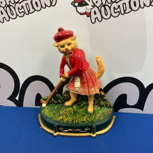 Vintage cast iron golfing cat doorstop, charming animal collectible.