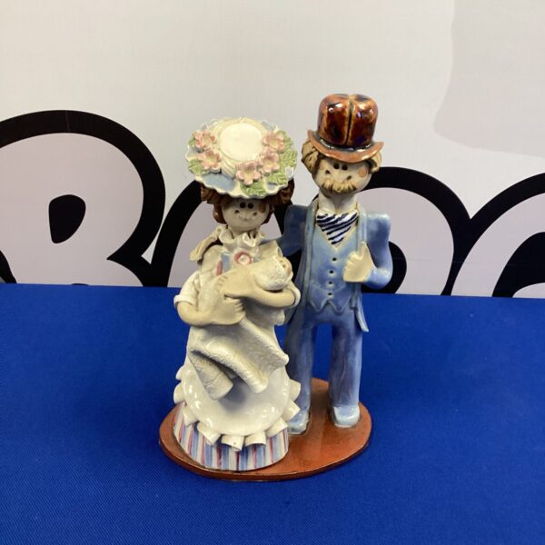 Vintage Laura Dunn Mr and Mrs porcelain figurine couple.