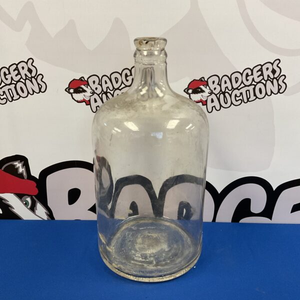 Antique Victorian demi john bottle for liquid storage.