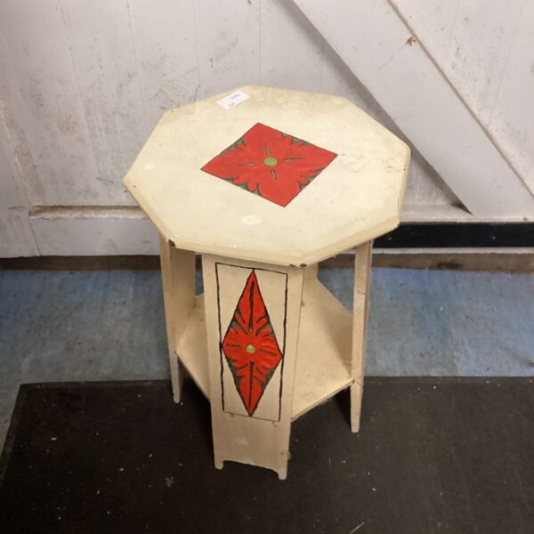Vintage hand-painted side table with hexagonal top and tiered shelf.