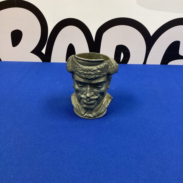 Detailed antique pewter trapper pot, collectible folk art figurine.