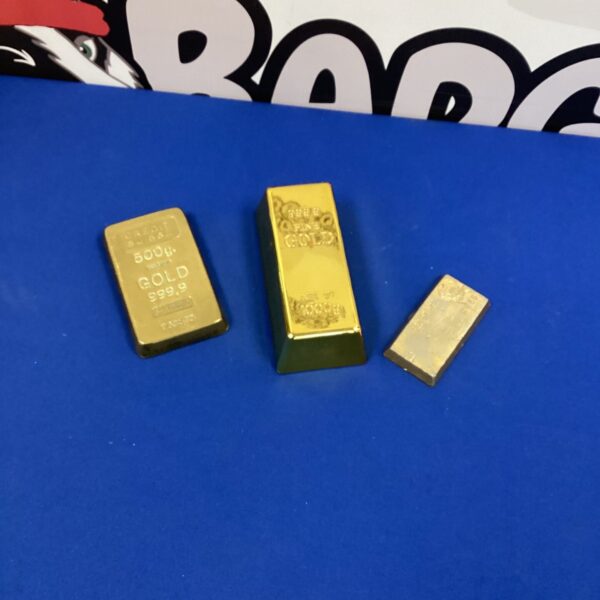 Lot of three fake gold paperweights for desk decoration.