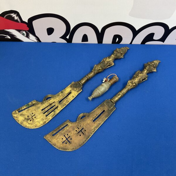 Set of four antique Nigerian Tiv ceremonial daggers on blue background.