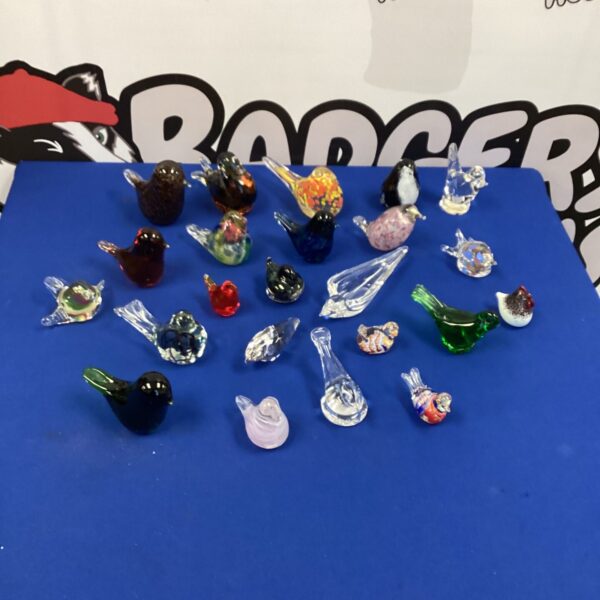 Colourful collection of glass bird paperweights for collectors.