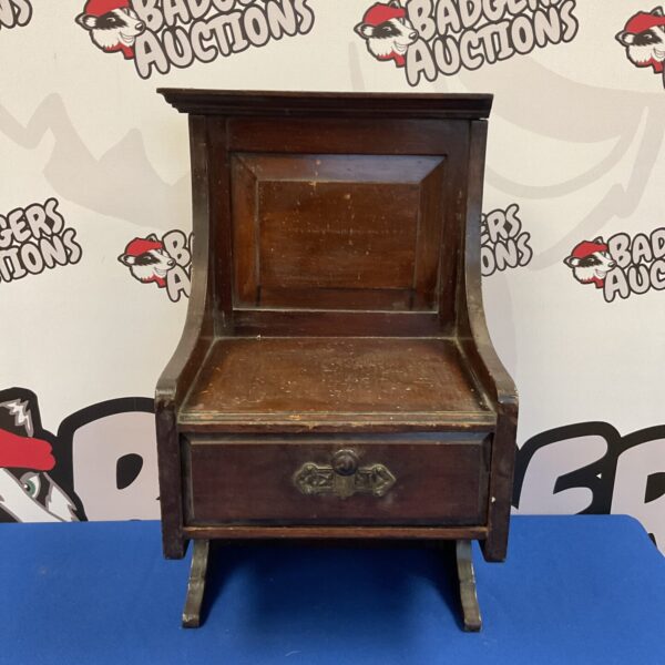 Vintage wall telephone cabinet with drawer, retro telecom equipment.