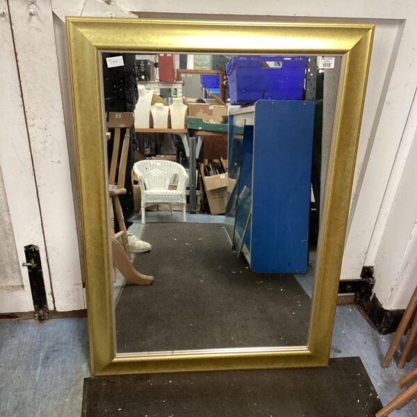 Vintage gilt framed mirror measuring 29x44 inches for wall decor.
