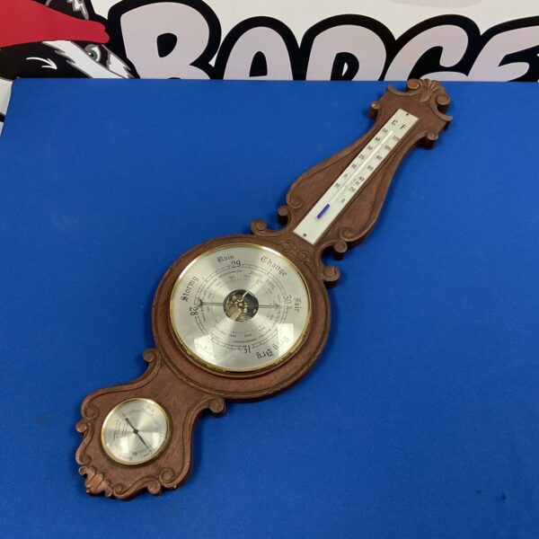 Vintage Weathermaster barometer with Fahrenheit and Celsius scales.