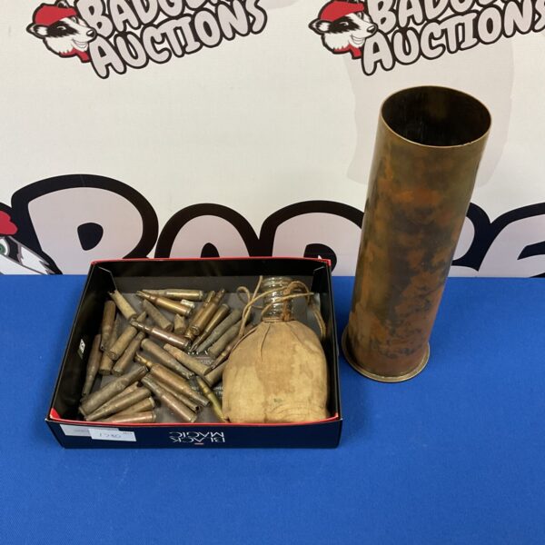 Lot of vintage bullet casings and a cannon shell for collectors.