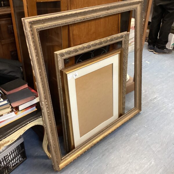 Ornate gold picture frame with a vintage aesthetic.