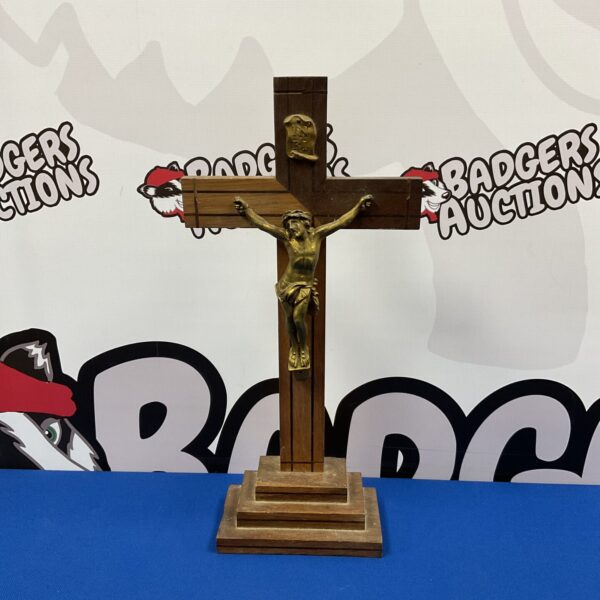 Vintage wooden crucifix with detailed brass Jesus figure.