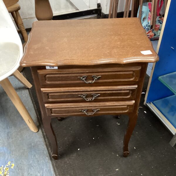 Vintage wooden hall cabinet with three drawers for storage.