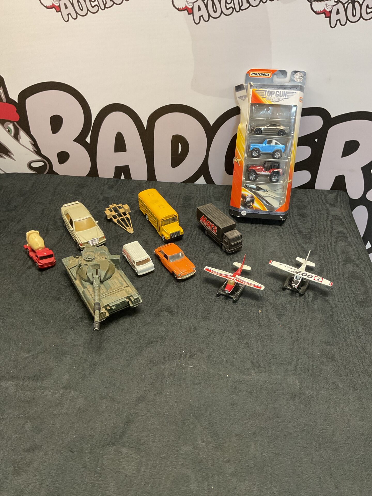 437 Box of diecast models inc matchbox top gun maverick set, dinky and