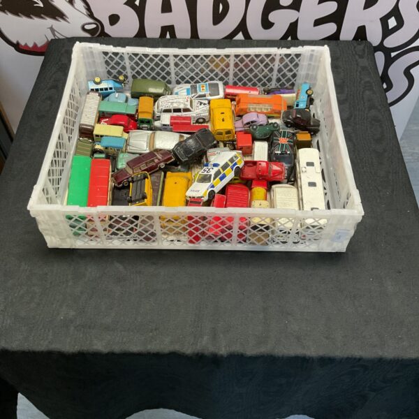 Crate of mixed vintage diecast toy cars, including Corgi and Dinky models.