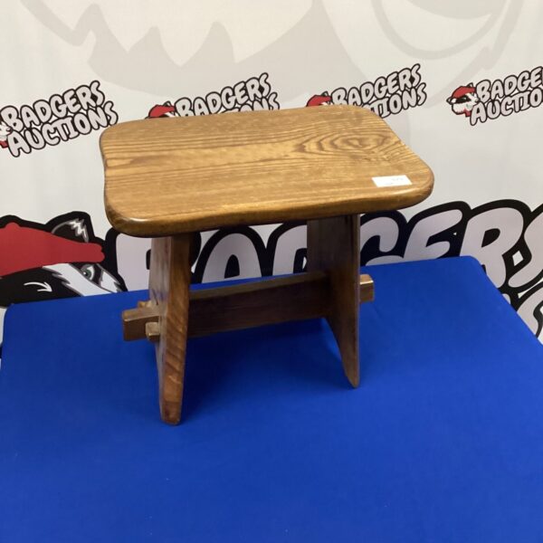 Vintage oak foot stool with curved legs, rustic farmhouse style.