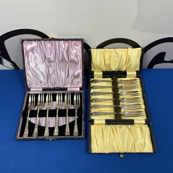 Vintage silver plate cake fork sets in presentation case.