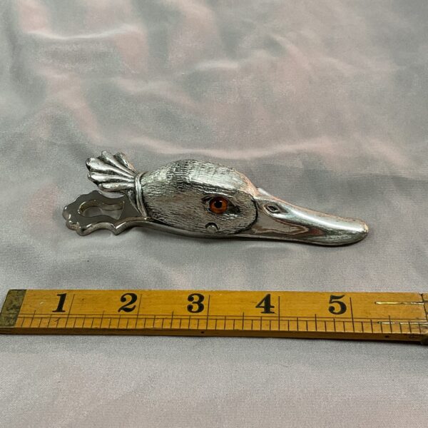 Vintage silver duck head letter clip for desk organisation.