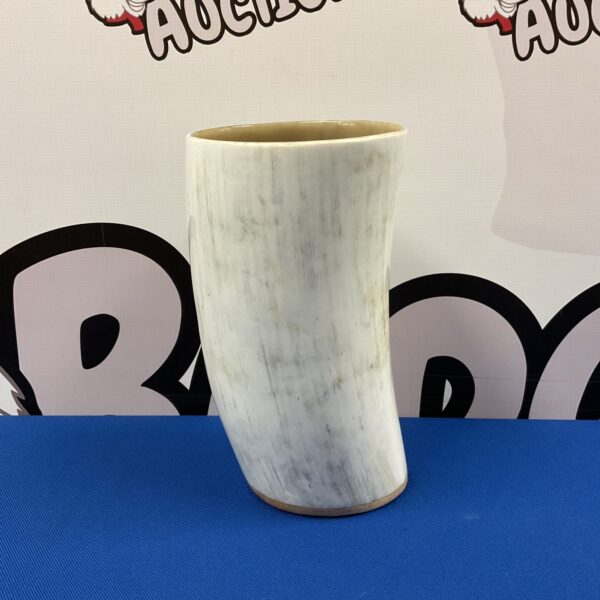Vintage horn flower vase for rustic floral arrangements.