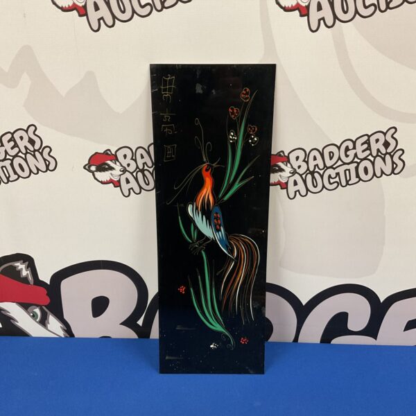 Vintage oriental brass panel with a colourful bird painting.