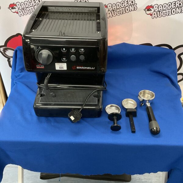 Simonelli Oscar professional coffee machine with attachments for espresso making.