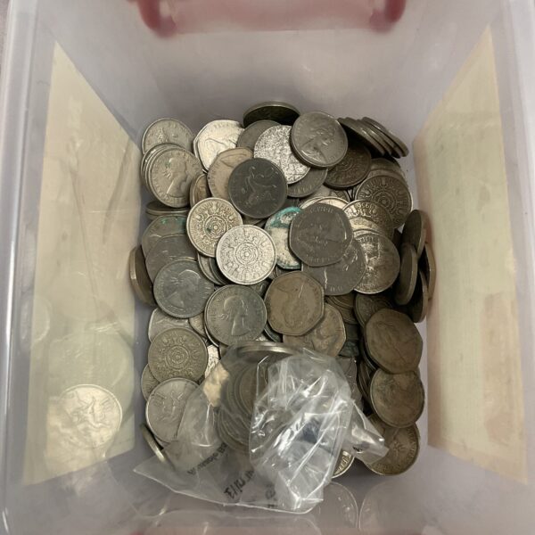 Collection of vintage British 50p and two shilling coins for collectors.