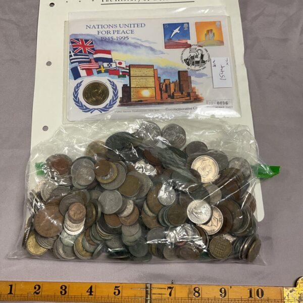 Nations United for Peace coin lot with foreign currency.