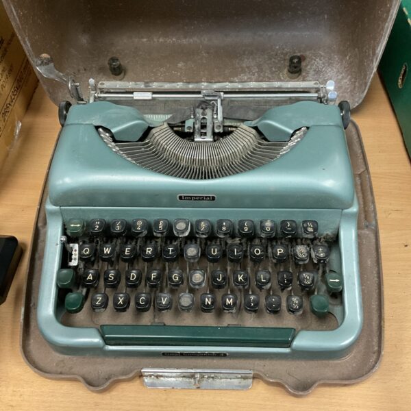Vintage Imperial Good Companion typewriter in silver and black.