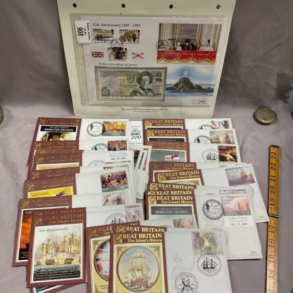 Collection of Lord Nelson First Day Covers and a British £1 note.