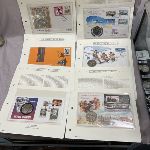 WWII First Day Covers coin collection featuring commemorative coins and stamps.