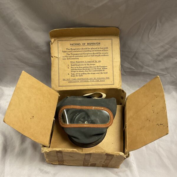 Vintage WW2 child’s gas mask in its original cardboard box.