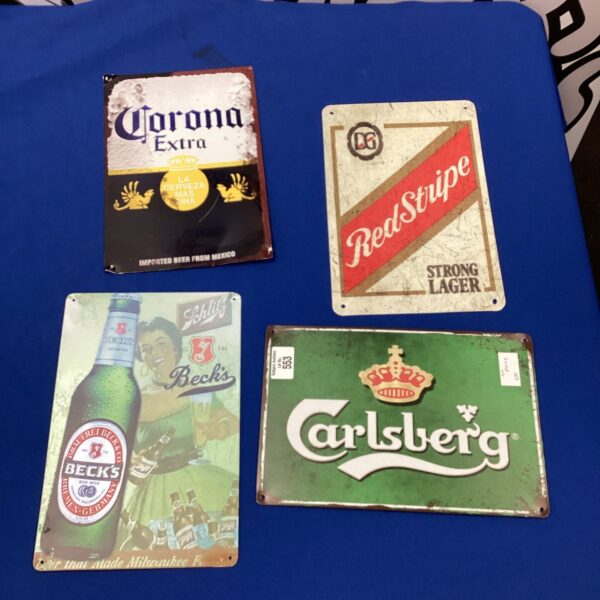 Lot of four vintage beer signs including Carlsberg, Corona, Becks and Red Stripe.