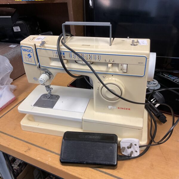 Vintage Singer Magic 34 sewing machine in a retro style.