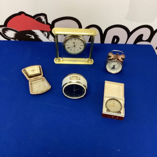 Vintage Whitehall mantel clock with white dial and brass case.