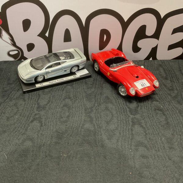 Vintage diecast model cars, Burago Ferrari and Shell Jaguar XJ220.