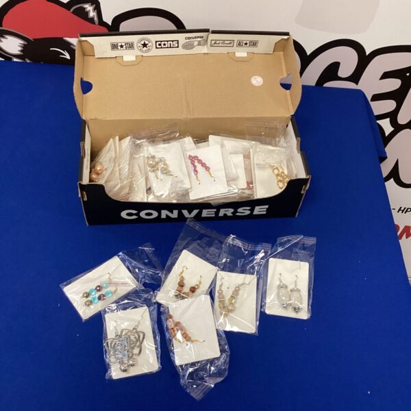 New earring lot in original packaging, assorted styles and colours.
