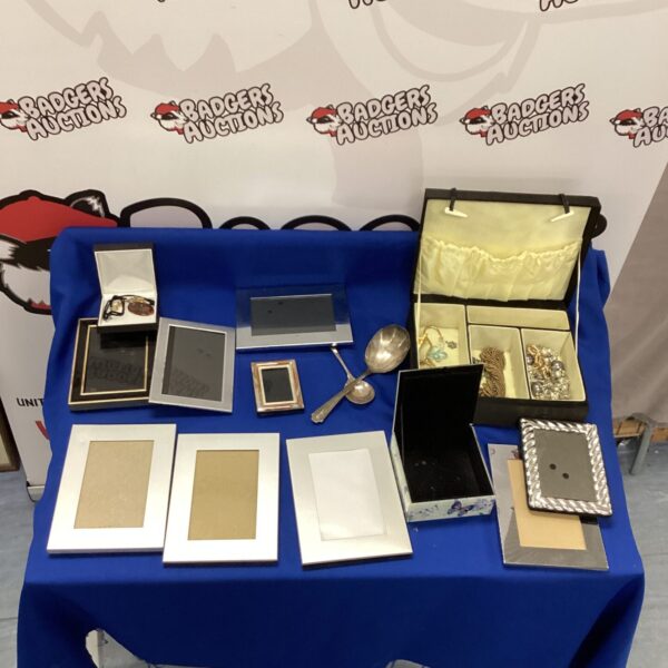 Assortment of new photo frames and a jewellery box with contents.