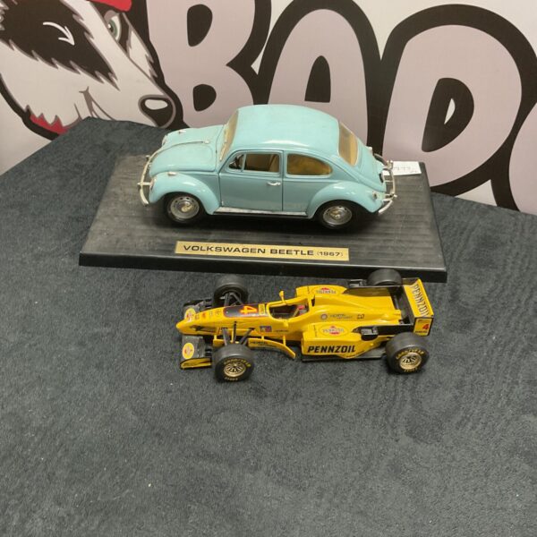 Light blue Volkswagen Beetle diecast model car.