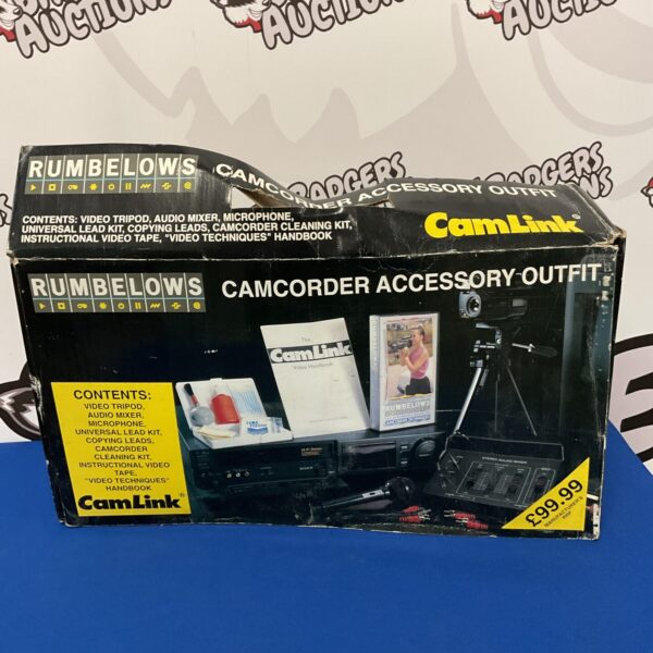 Vintage Rumbelows camcorder accessory kit with manual and tripod.
