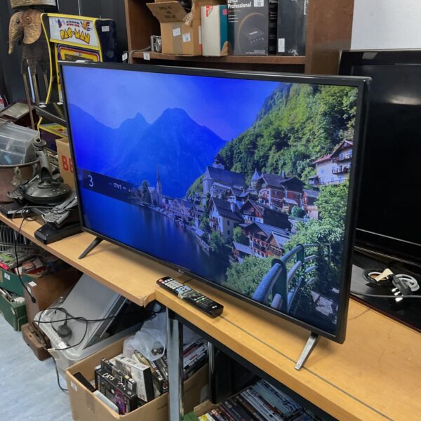 LG 43" HD television with remote control, flat screen TV.