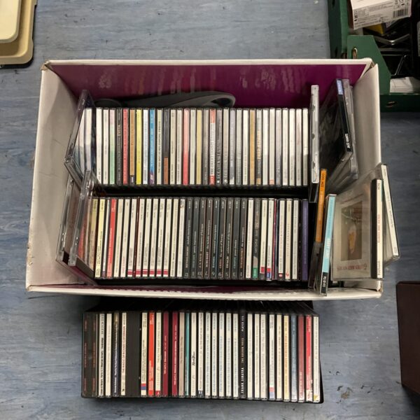 Box of vintage jazz CDs for sale.