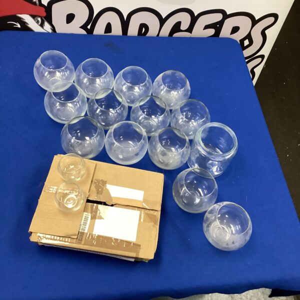 Lot of clear glass bowl vases for home decor and floral arrangements.