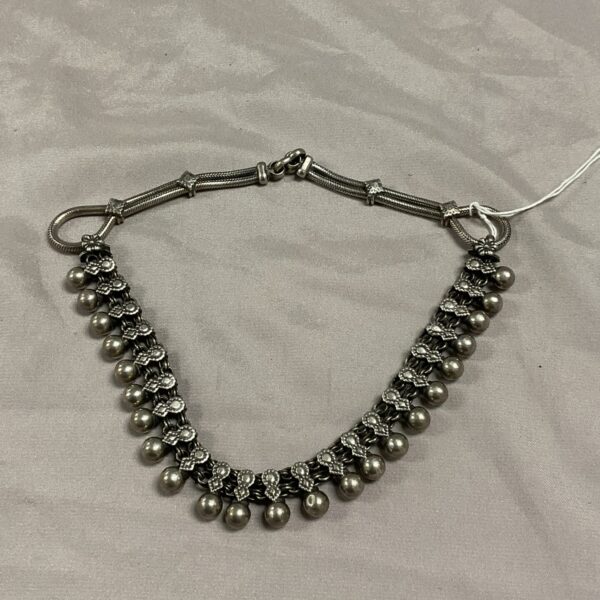 Vintage Indian silver necklace with spherical pendants.