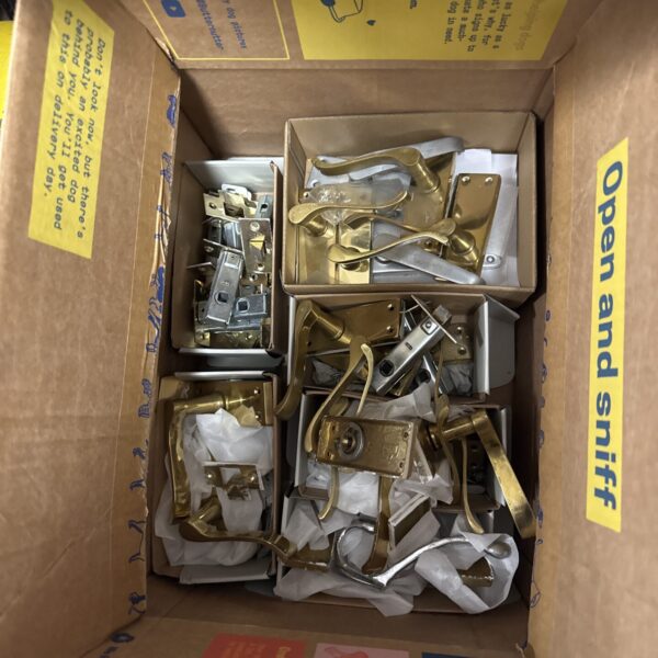 Vintage brass door furniture lot with knobs and handles.