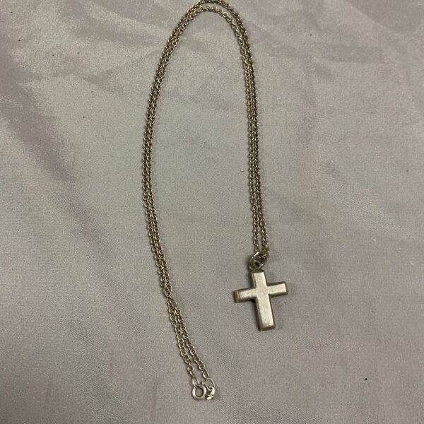 Vintage silver cross pendant on a 24 inch chain.