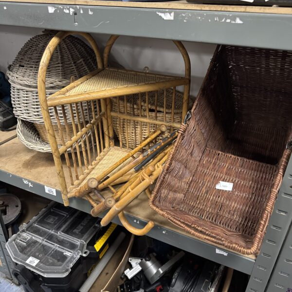 Vintage wicker baskets and bamboo coat hook for rustic decor.