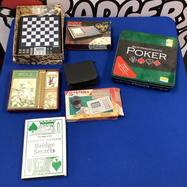 Vintage card games lot featuring bridge and whist sets.