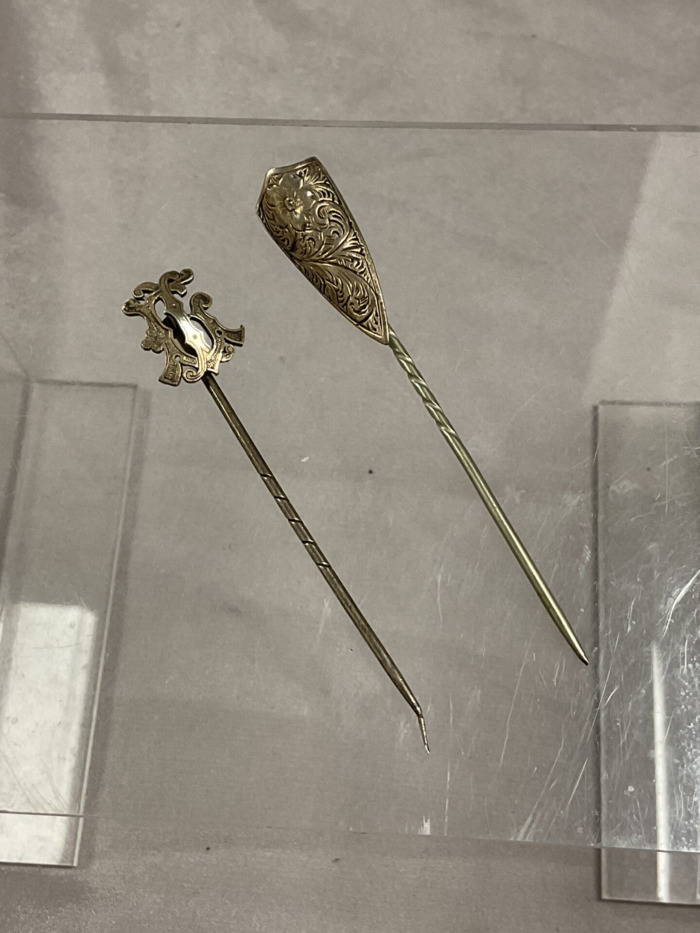 939 Two white metal stick pins
