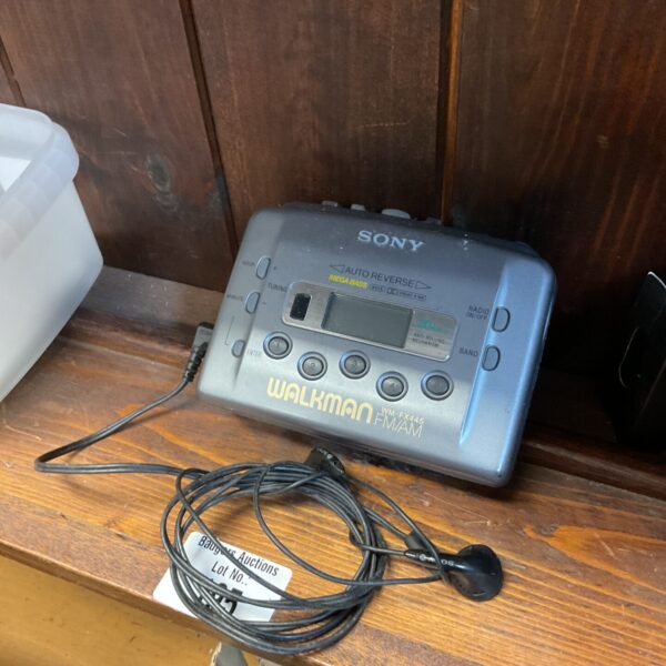 Vintage Sony WM-FX445 Walkman cassette player with headphones.