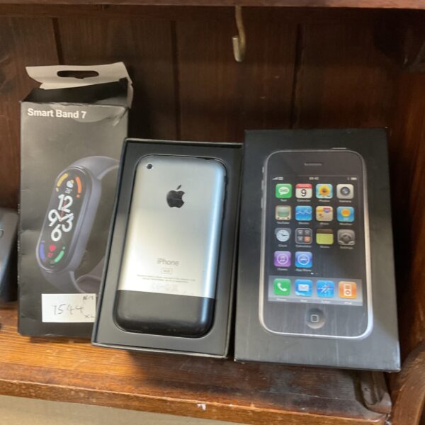 Apple iPhone 3G and Smart Band 7 watch displayed together.