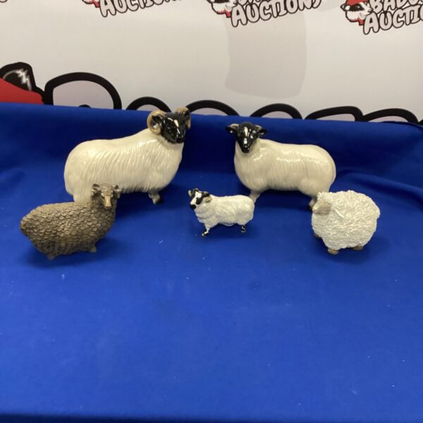 Vintage Beswick sheep ornaments, a charming ceramic flock.